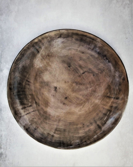 Handmade gray ceramic charger – top view