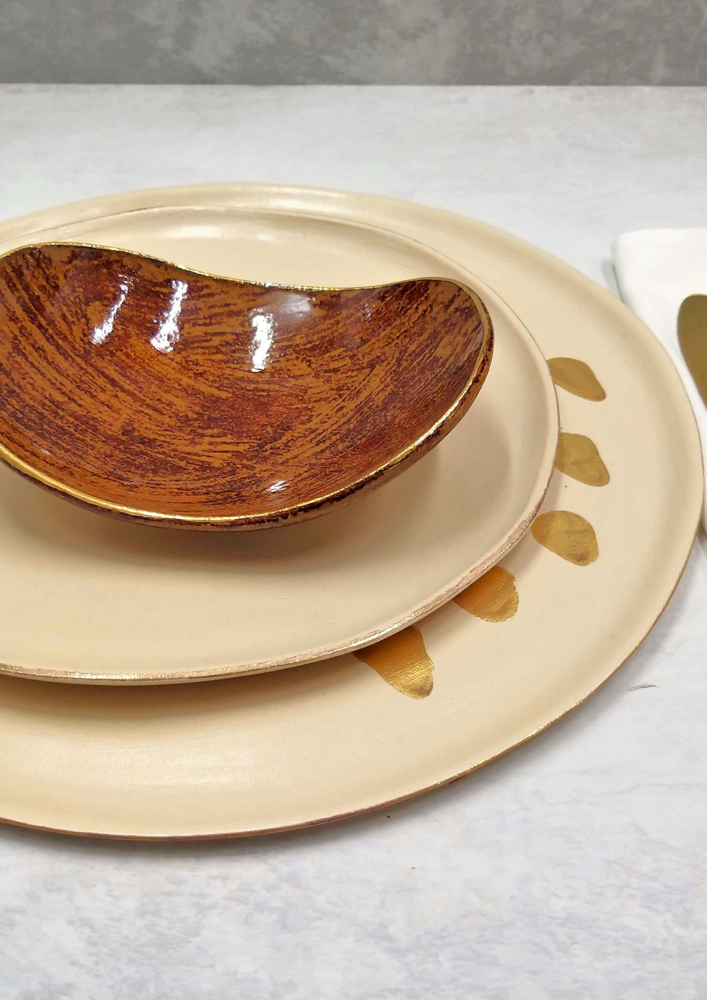 Brown cream and gold ceramic plats