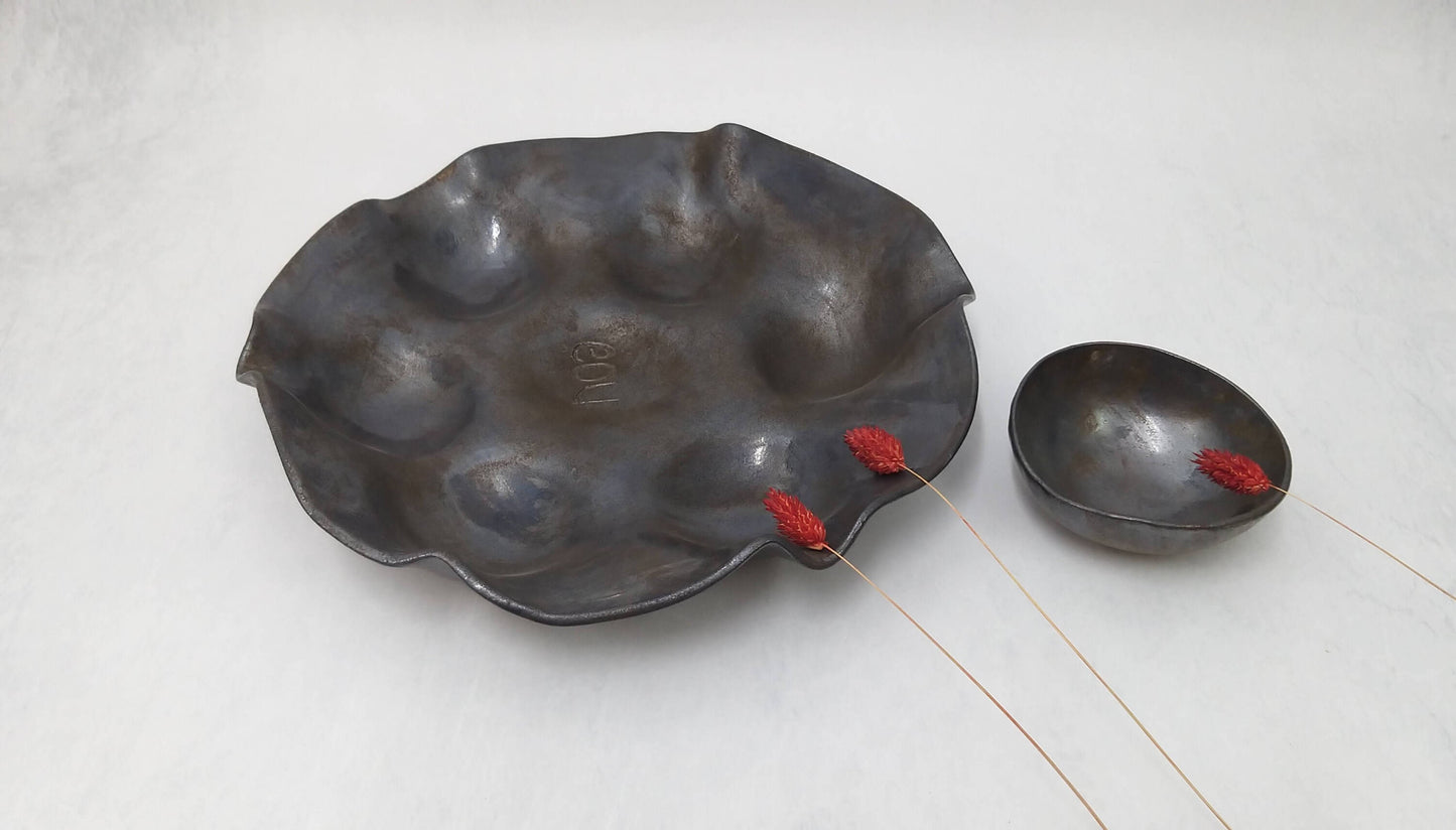 Black and bronze sculpted platter for appetizers