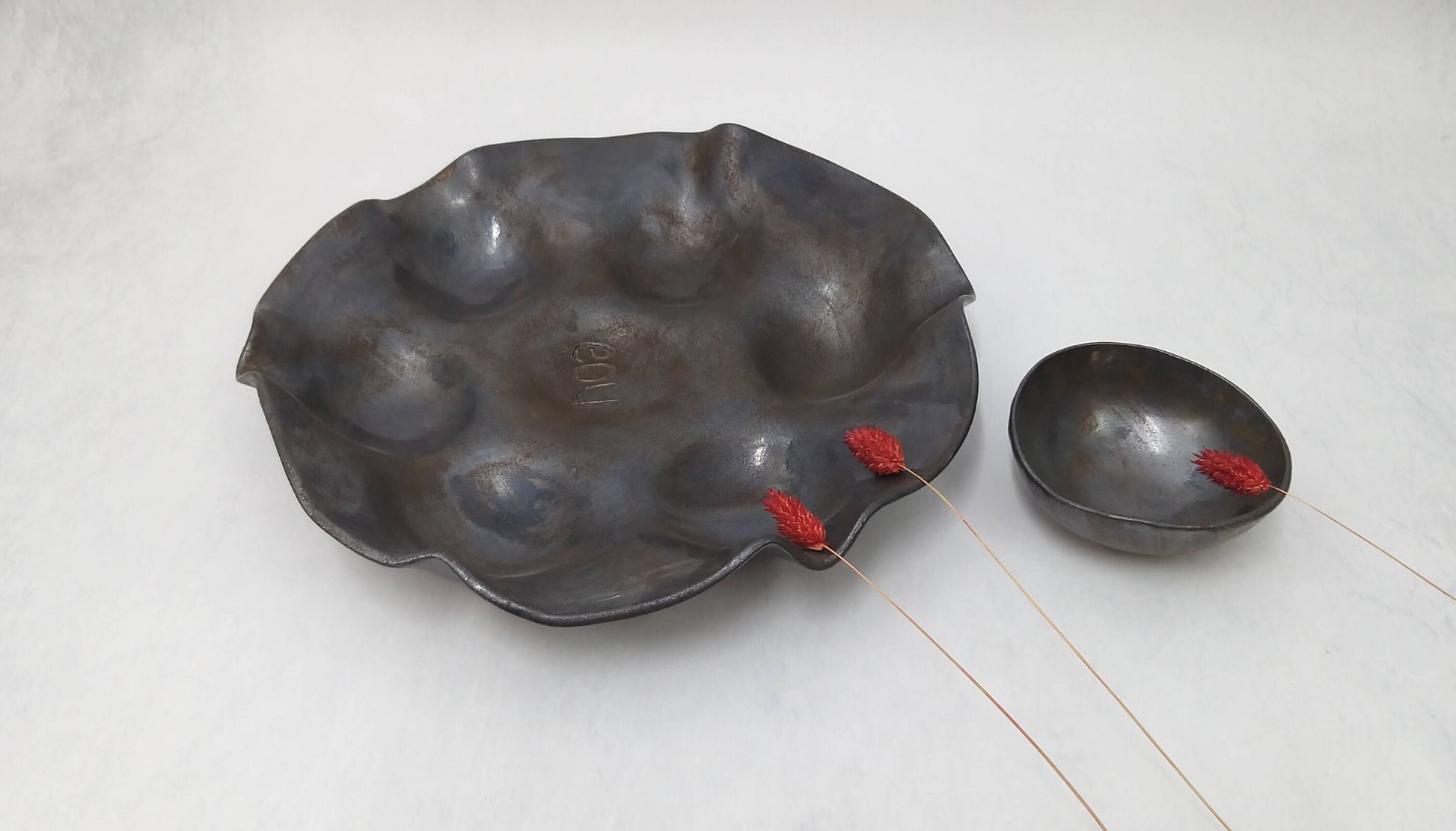 Black and bronze sculpted platter for appetizers