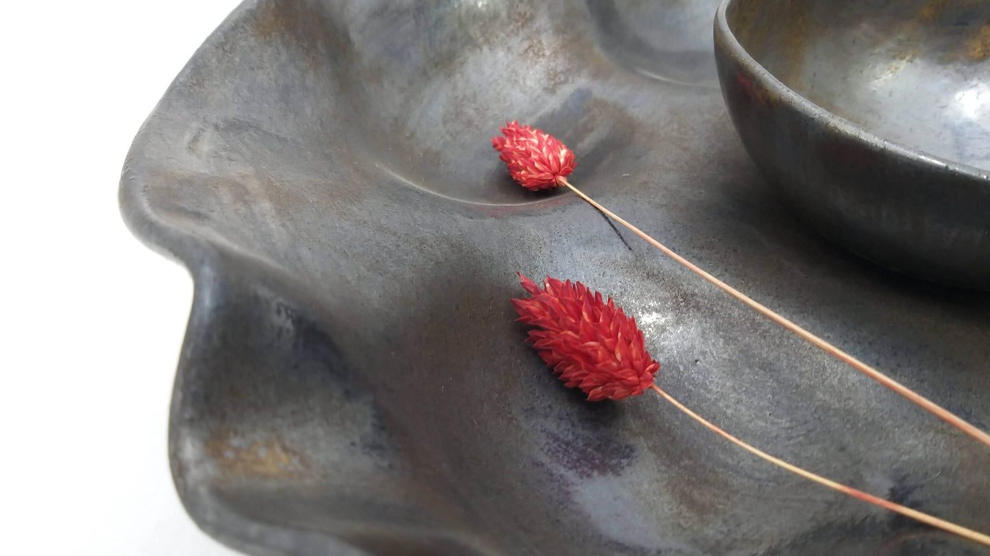Close-up of ceramic serving bowl and textured dish