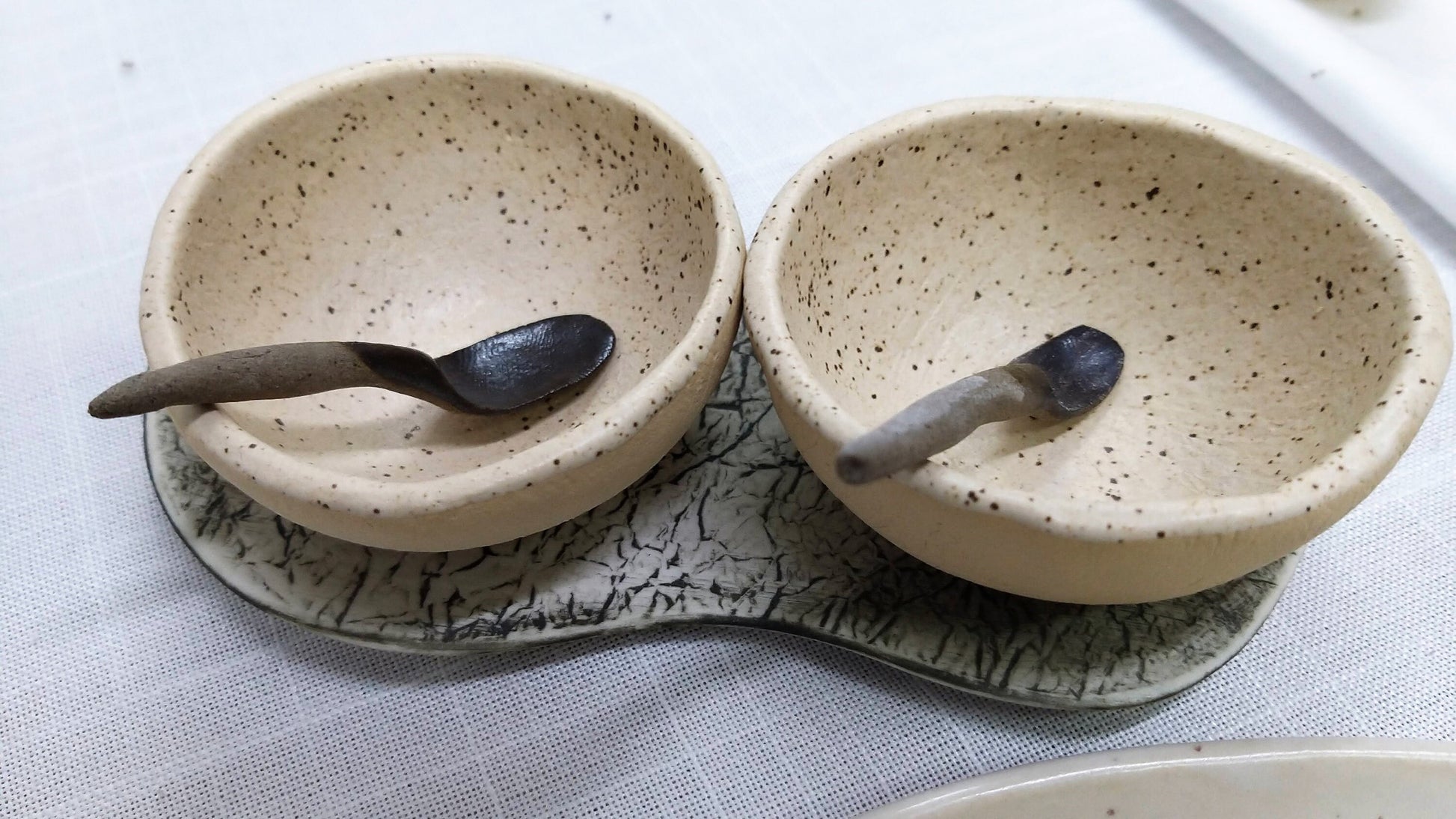 Salt and pepper dishes styled on tray