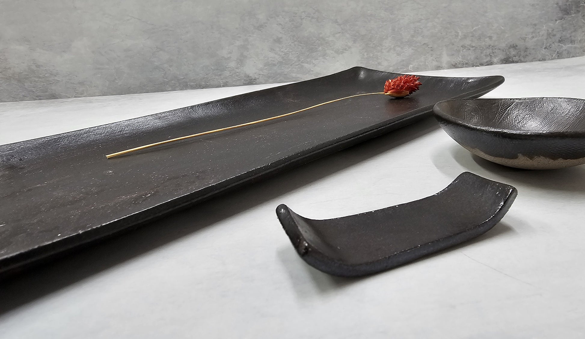 Minimalist rectangular plate with sauce bowl and chopstick rest