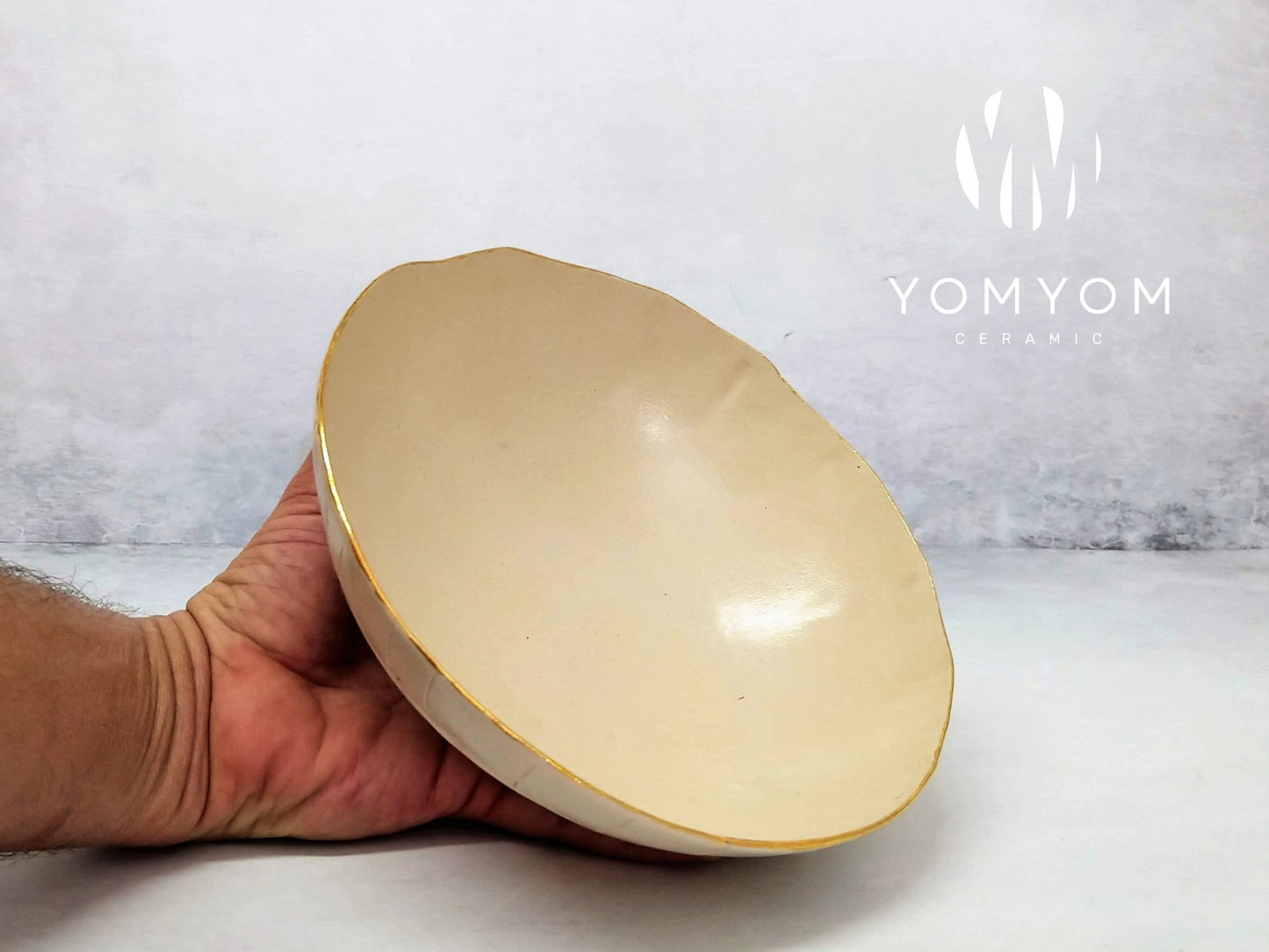 White and gold ceramic bowl