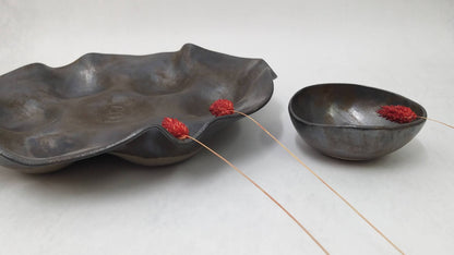 Wavy ceramic serving platter with matching bowl