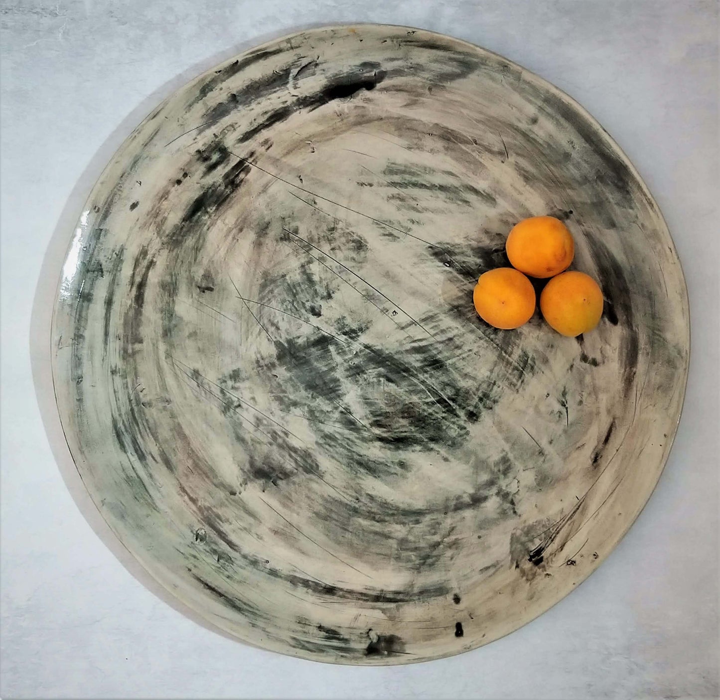 Gray ceramic handmade tray of serving