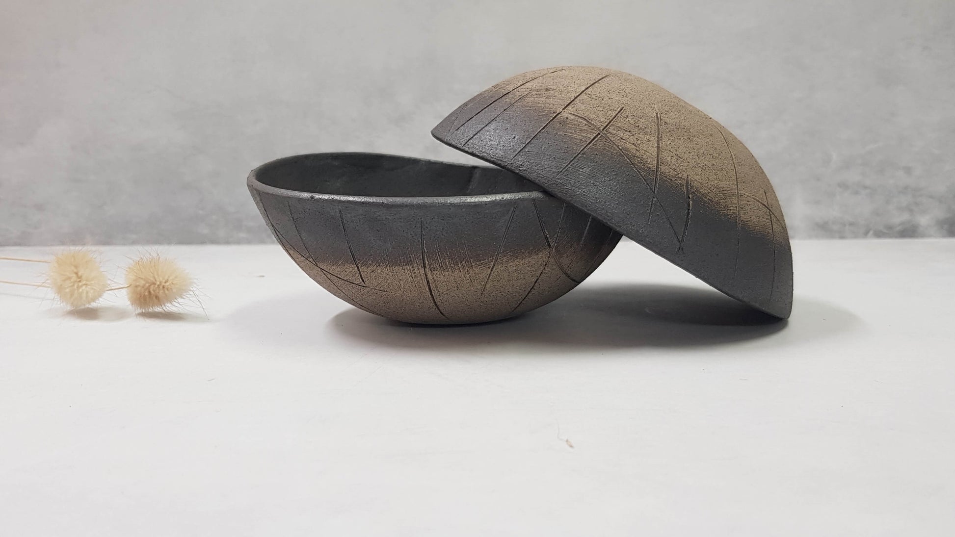 Two black ceramic bowls