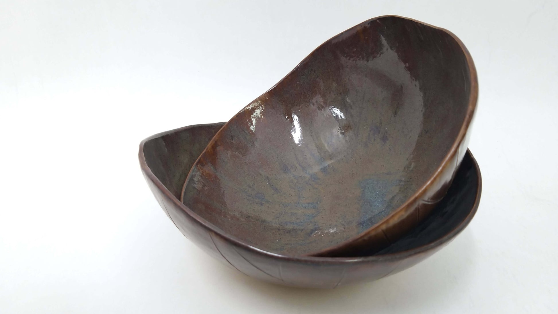 Two brown ceramic bowls