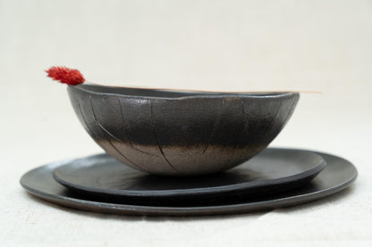 Close-up of textured matte black bowl