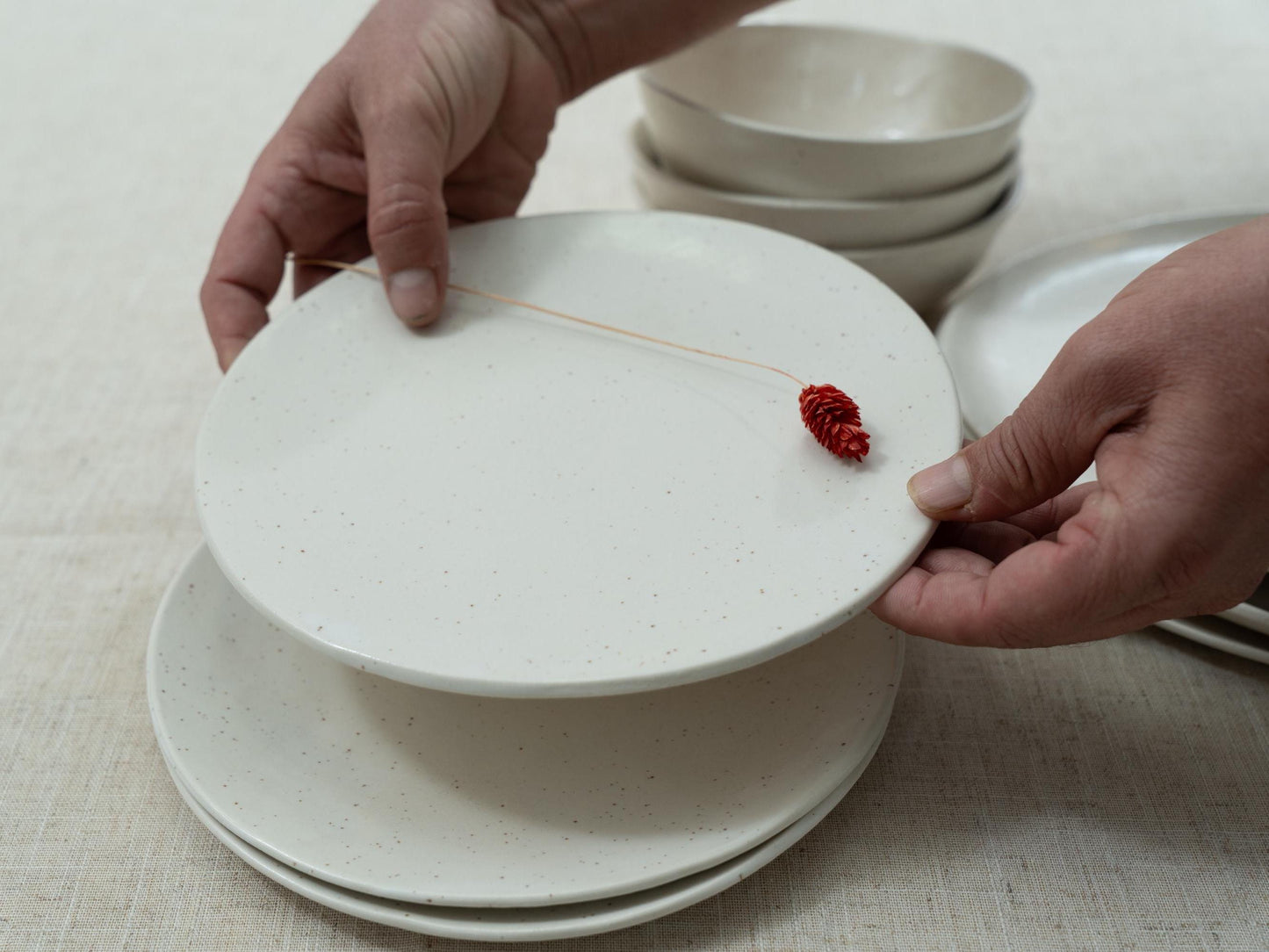 Soft white glaze with black speckles