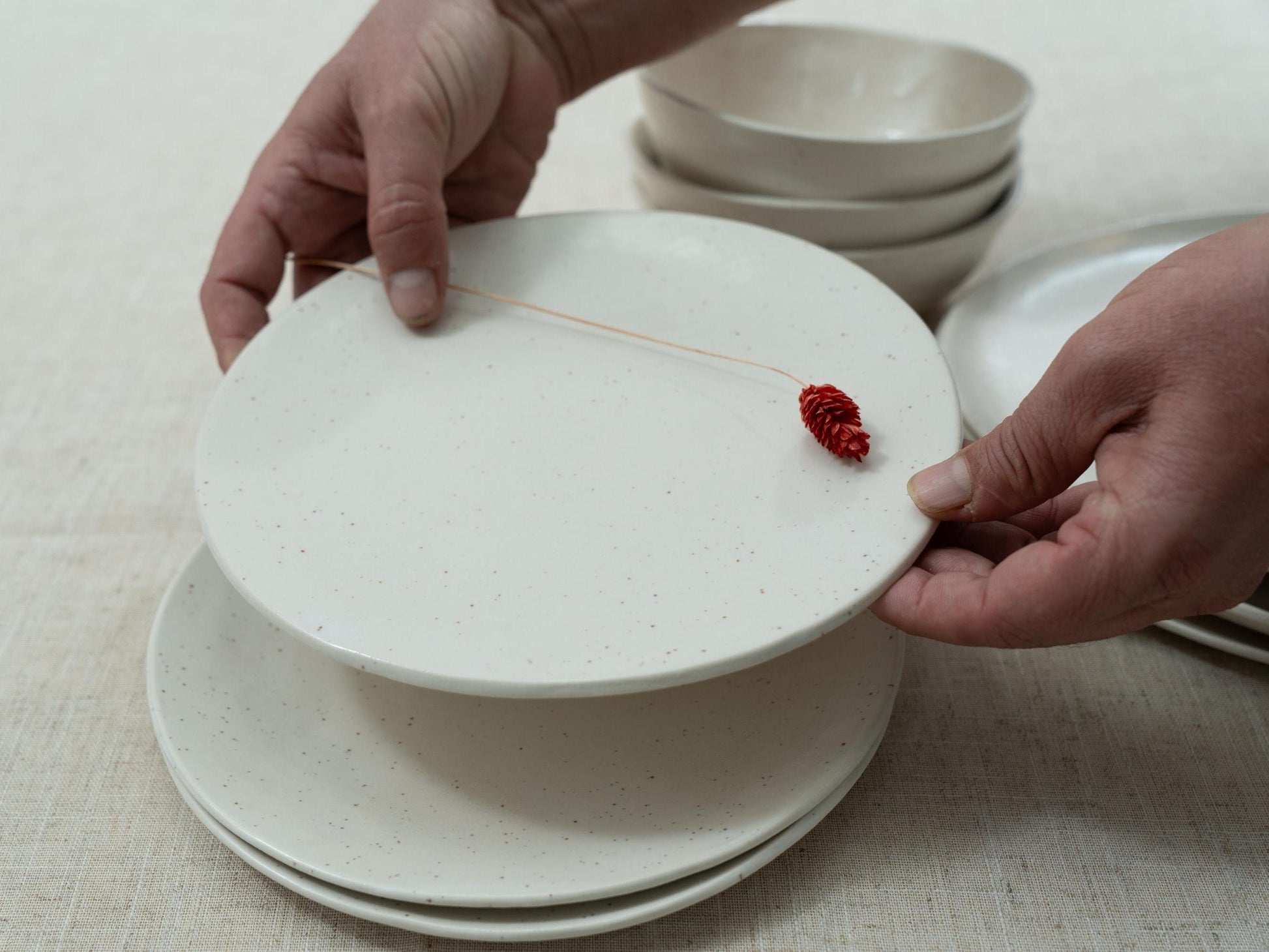 Soft white glaze with black speckles