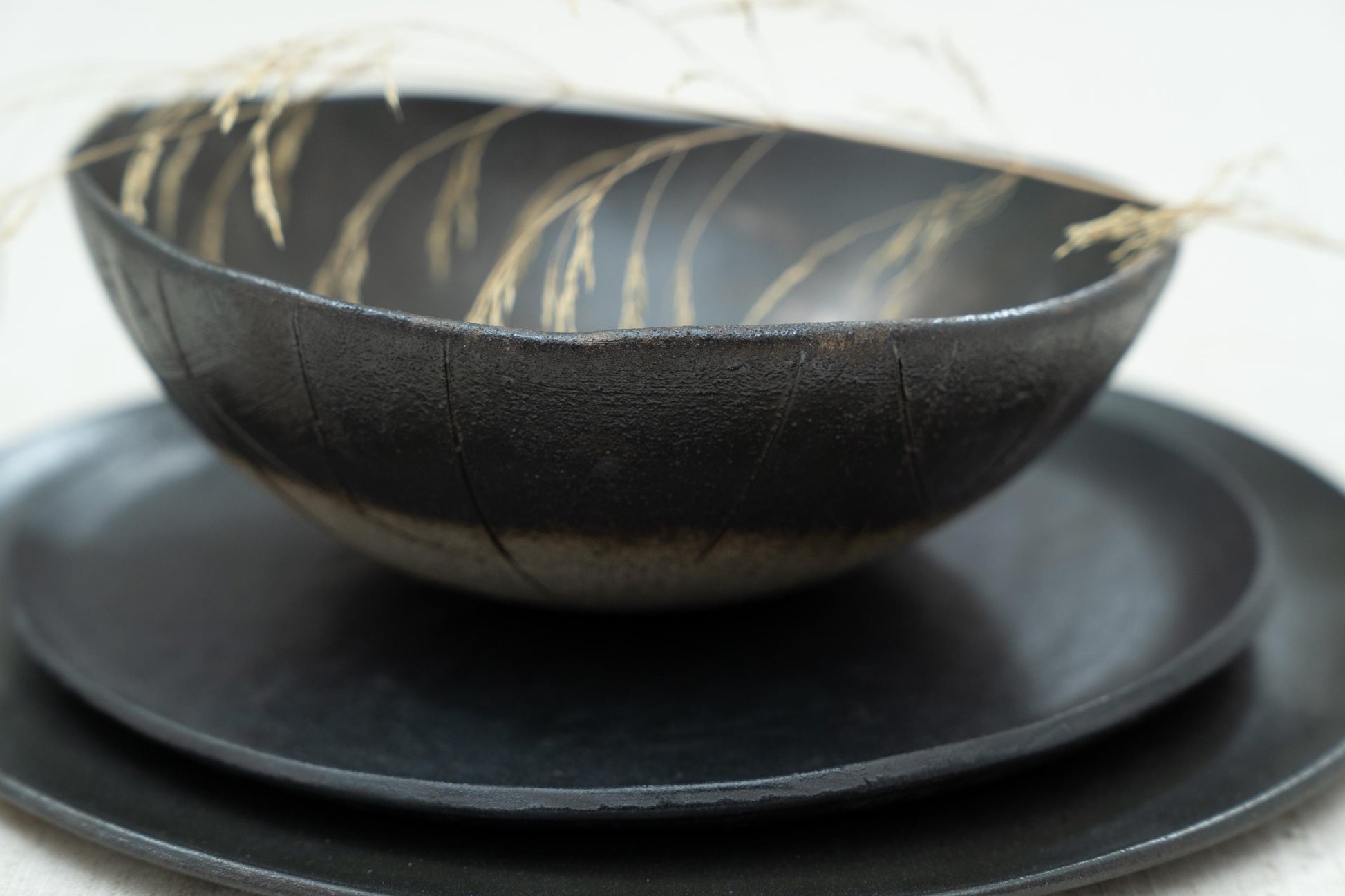 Top-down view of stacked plates and bowl