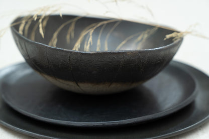 Top-down view of stacked plates and bowl