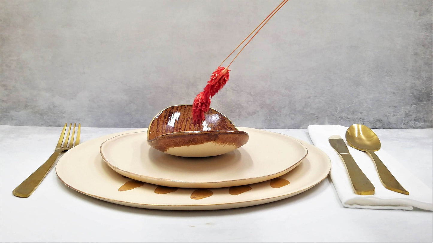 Golden caramel oval plate made of natural clay with matte finish