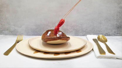 Golden caramel oval plate made of natural clay with matte finish