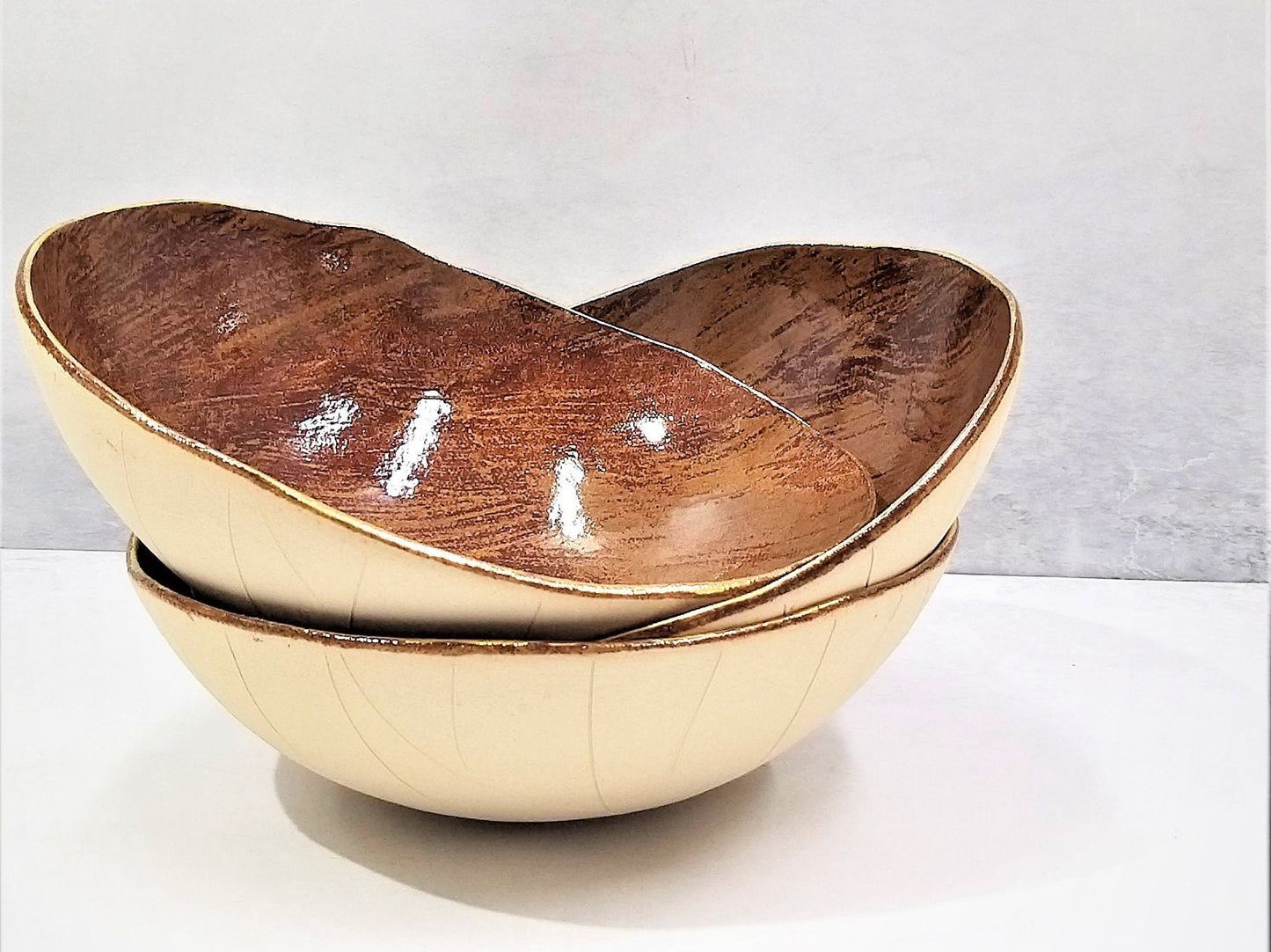 Brown toned ceramic bowl with gold rim