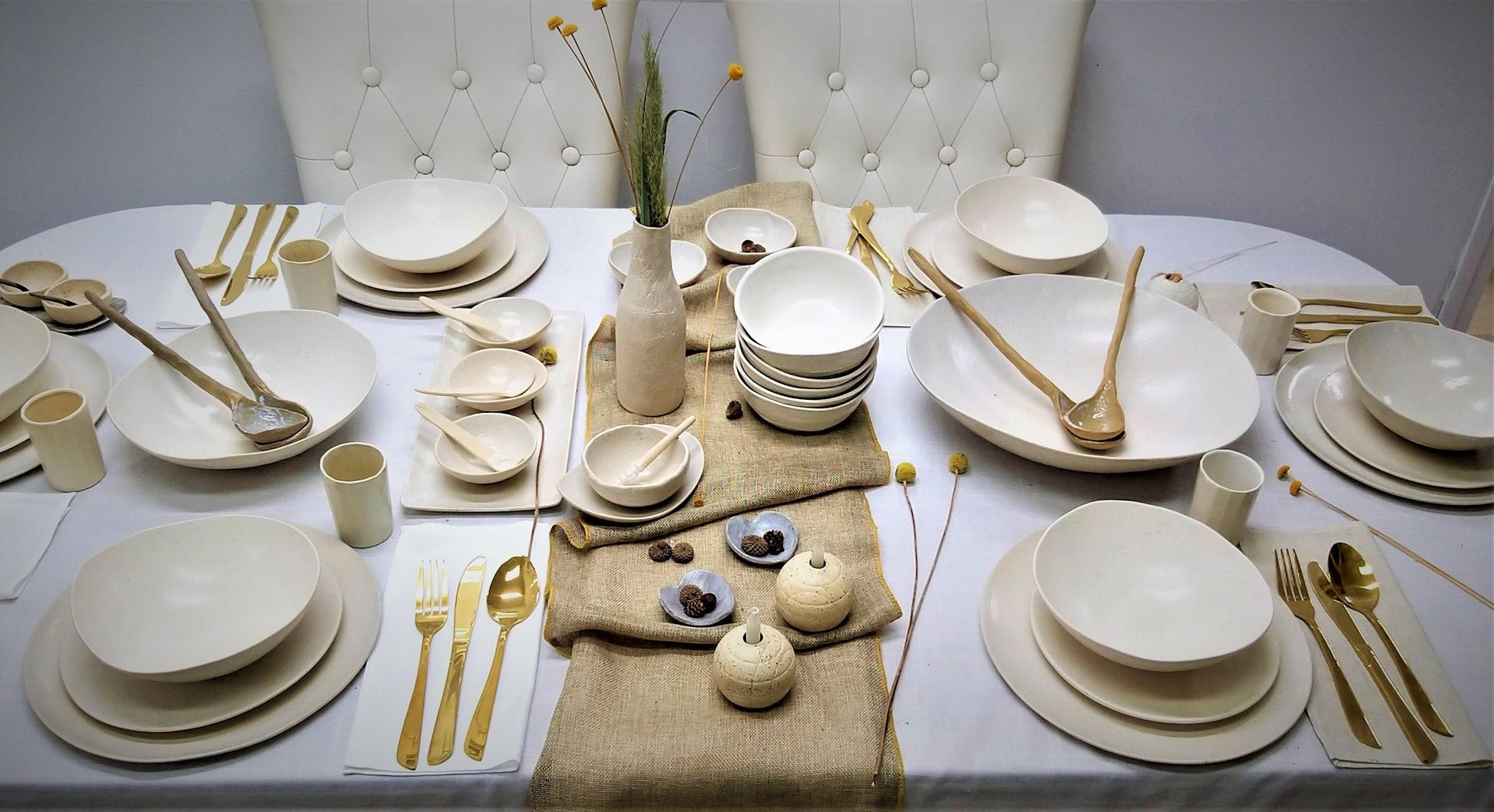 Full shot of white handmade ceramic set
