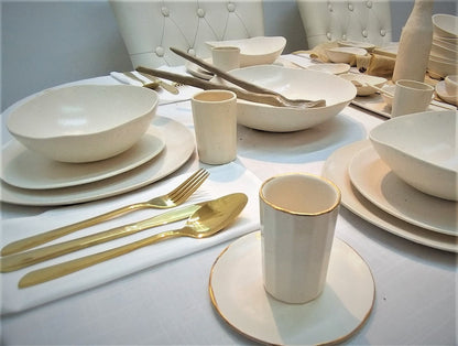 Glazed white plate with small accessories