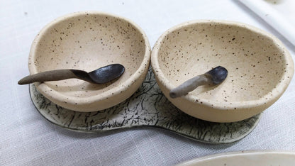 Salt and pepper dishes styled on tray