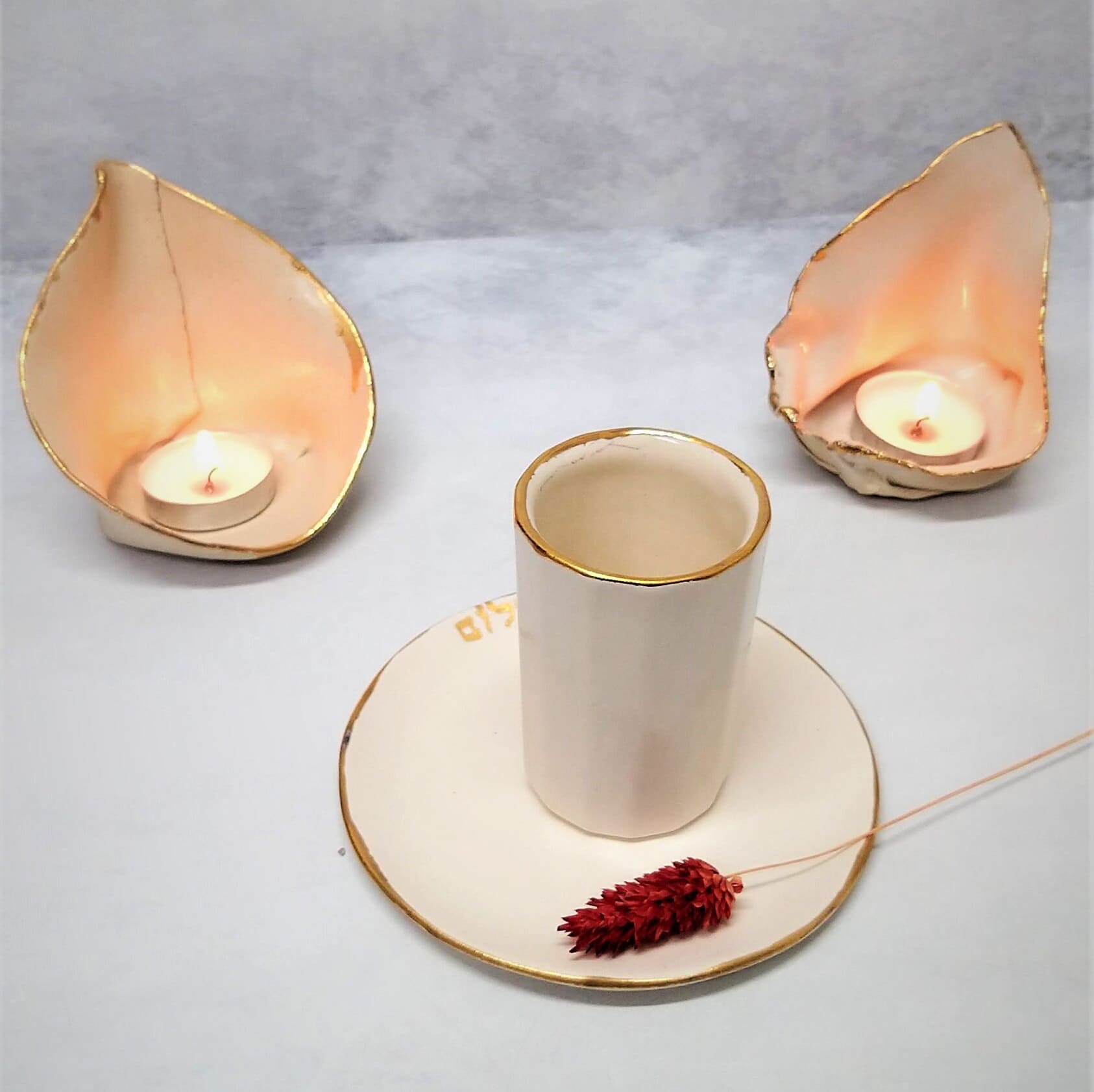 Ceramic candlesticks with gold rim and cup for kiddush
