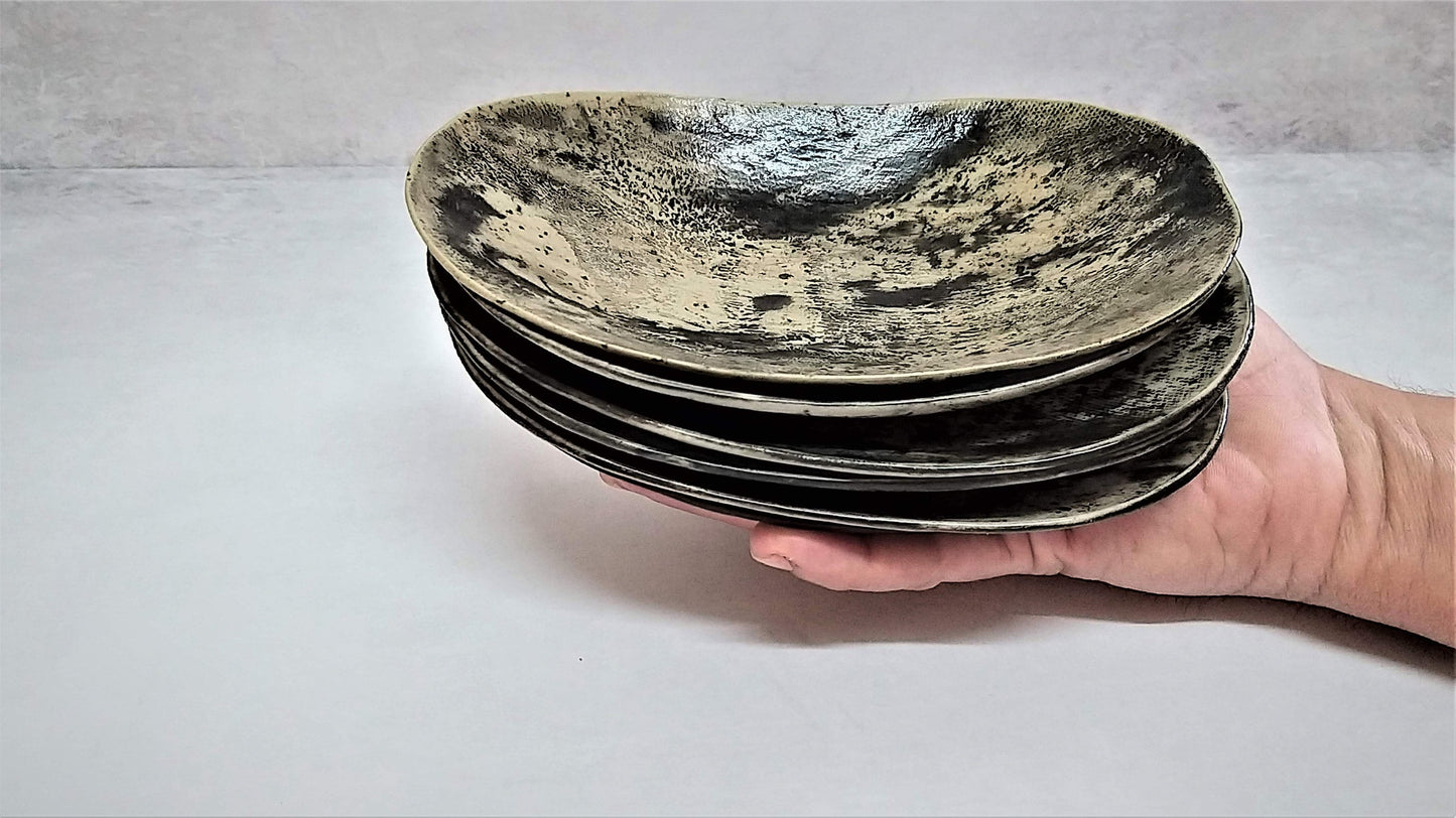 Oval ceramic plates in shades of gray