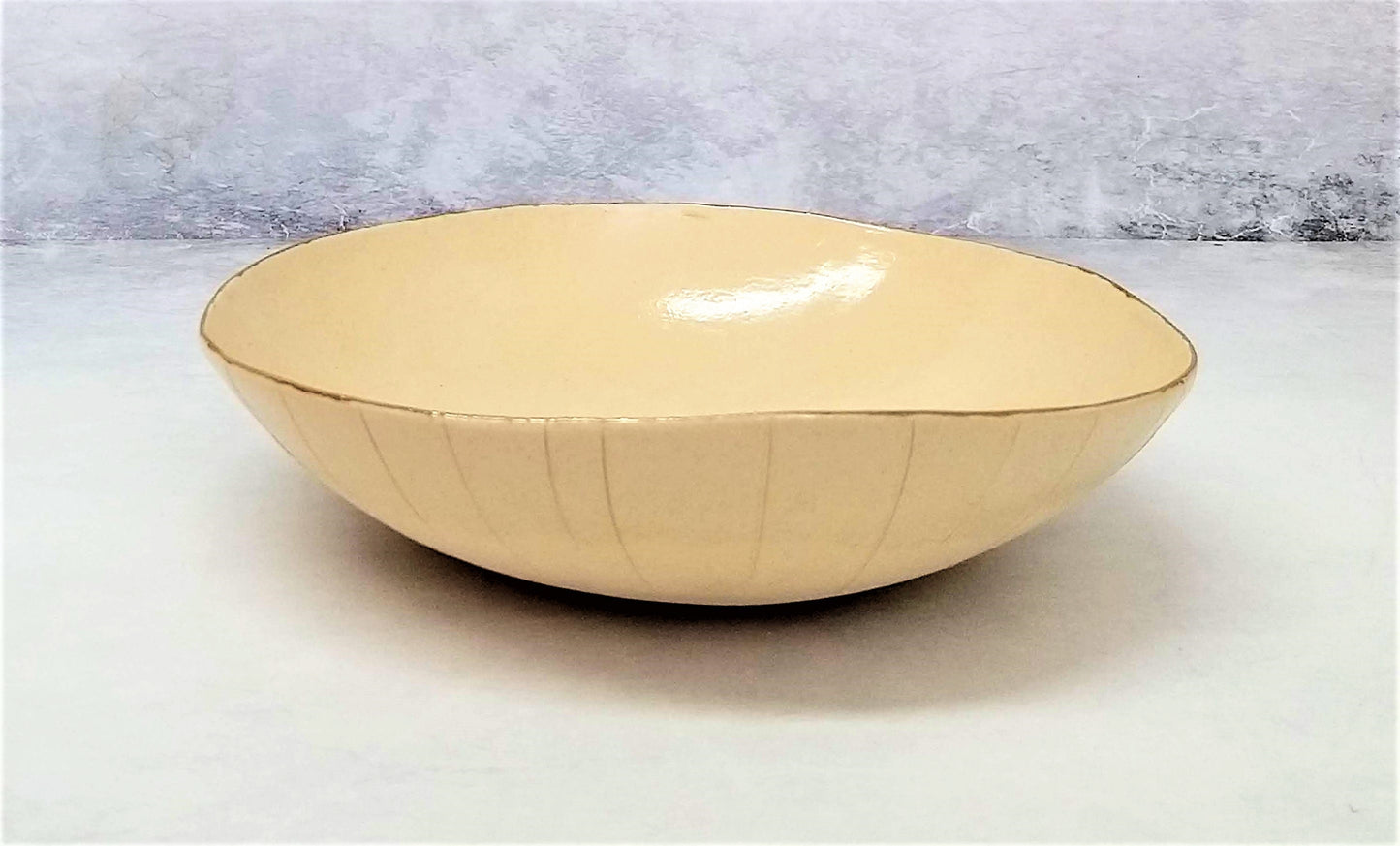 White cream with gold ceramic bowl