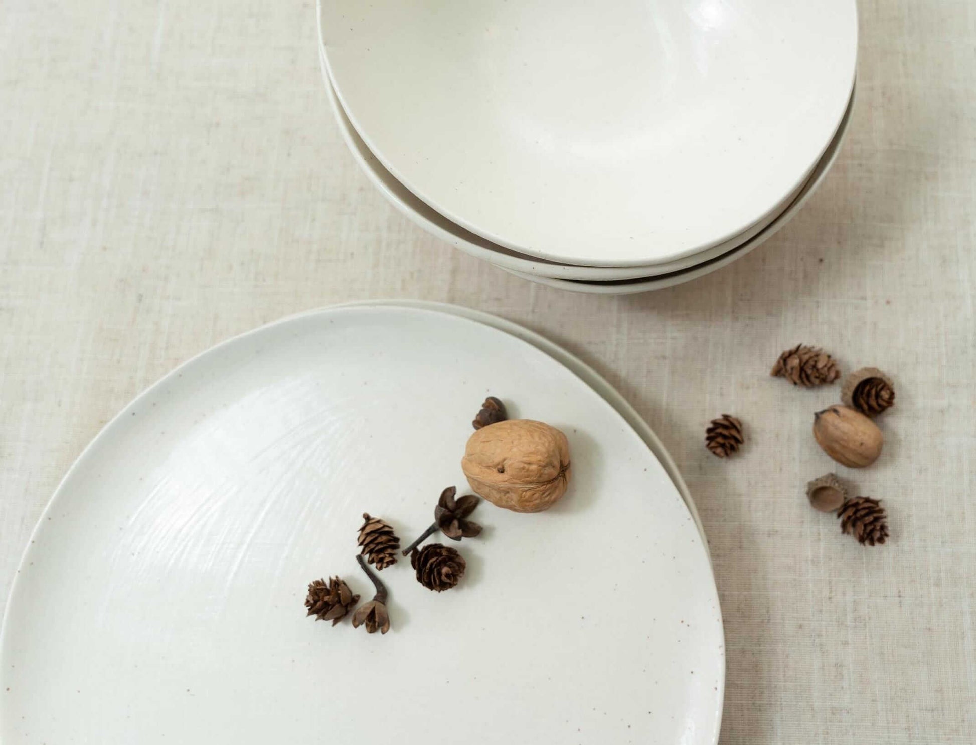 Stacked handmade bowls on plates