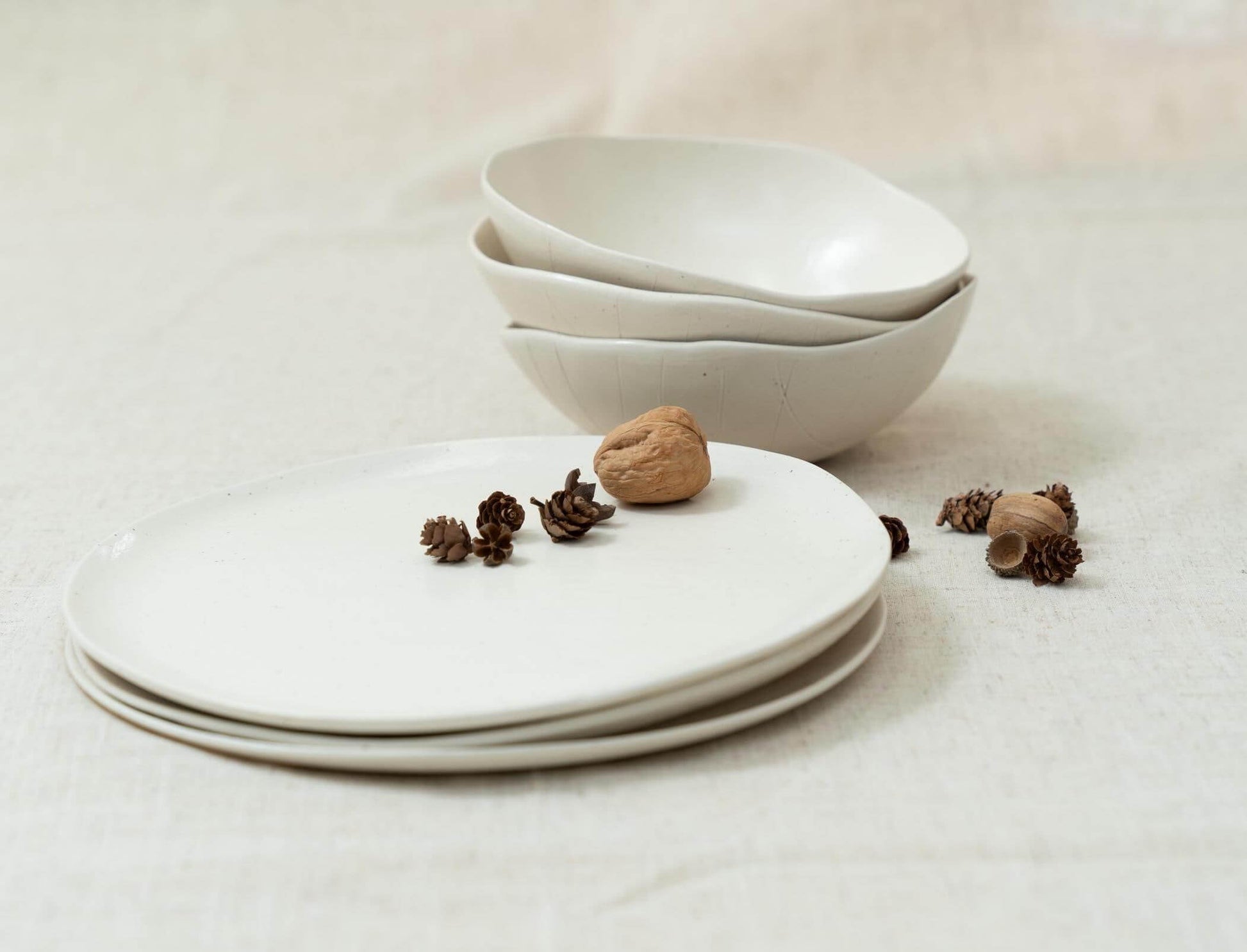 Minimalist ceramic design on cream fabric