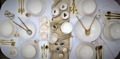 Full dinner setting with white modern ceramics