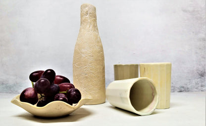 A set of cups and a ceramic bottle